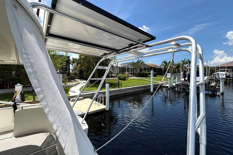 Slide: The Image of Fountaine Pajot Maryland 37 yacht docked, showcasing solar panels and marina view. - 12
