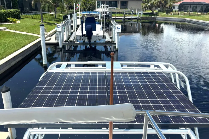 Slide: The Image of Solar panels on a 2000 Fountaine Pajot Maryland 37 yacht docked by a canal. - 24