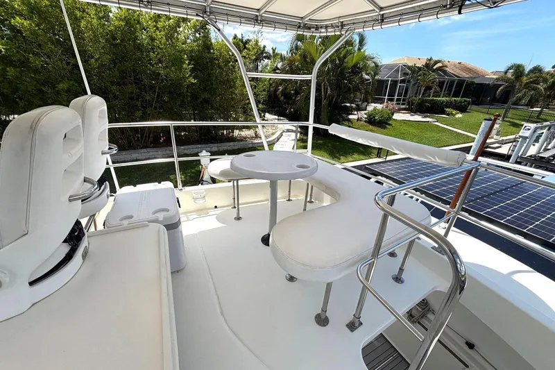 Slide: The Image of Flybridge of 2000 Fountaine Pajot Maryland 37 yacht with seating and table. - 25