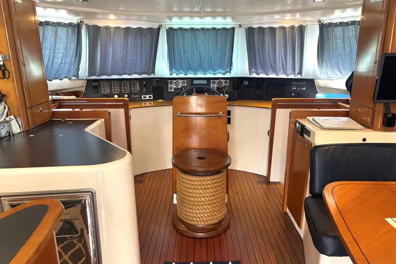 Slide: The Image of Interior of 2000 Fountaine Pajot Maryland 37 yacht with wooden finishes and navigation controls. - 31