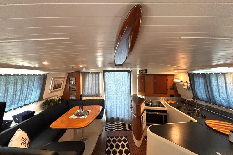 Slide: The Image of Interior of 2000 Fountaine Pajot Maryland 37 yacht with modern kitchen and dining area. - 32