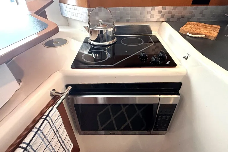 Slide: The Image of Galley kitchen in 2000 Fountaine Pajot Maryland 37 with stove and microwave. - 40