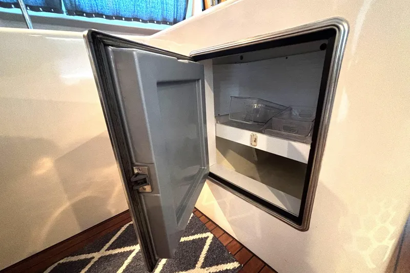 Slide: The Image of Open storage compartment on 2000 Fountaine Pajot Maryland 37 yacht, featuring interior shelving. - 42