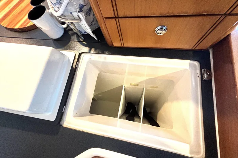 Slide: The Image of Open storage compartment in 2000 Fountaine Pajot Maryland 37 yacht kitchen area. - 43