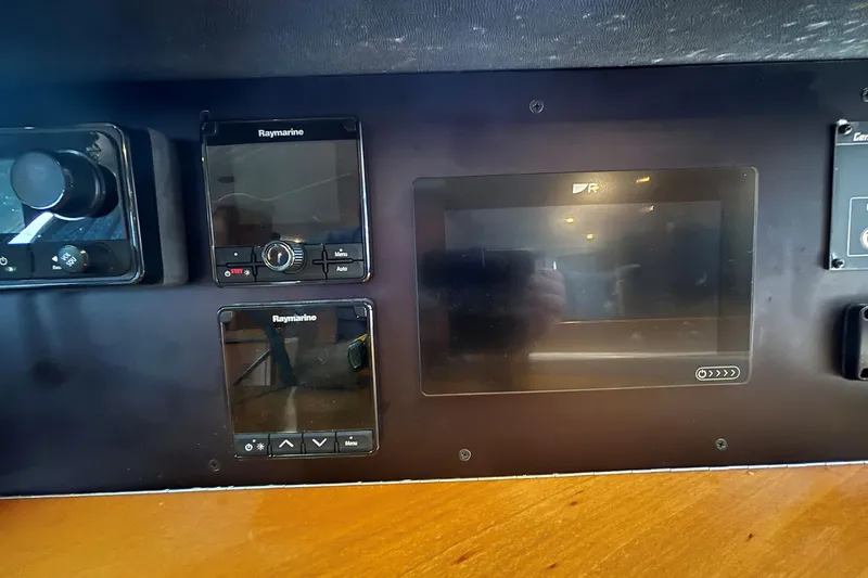 Slide: The Image of Control panel of a 2000 Fountaine Pajot Maryland 37 with Raymarine navigation equipment. - 55