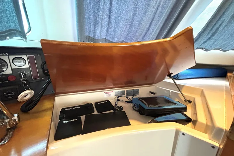 Slide: The Image of Control panel of 2000 Fountaine Pajot Maryland 37 with Raymarine equipment and wooden cover. - 57