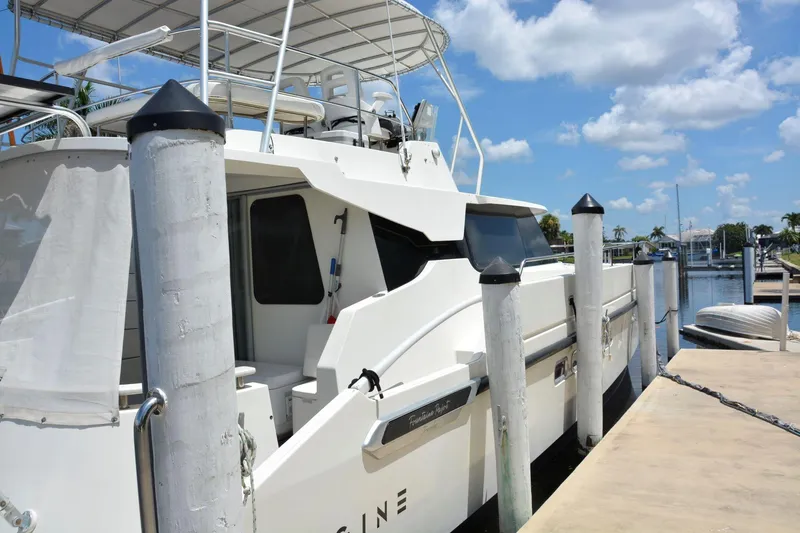Slide: The Image of Fountaine Pajot Maryland 37 yacht docked at marina, clear sky, 2000 model. - 6