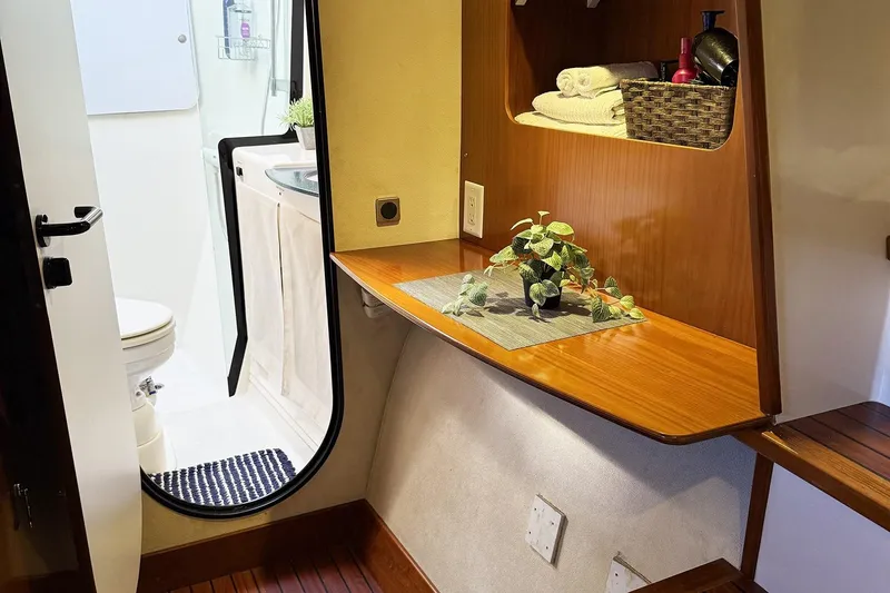 Slide: The Image of Interior of 2000 Fountaine Pajot Maryland 37 yacht with bathroom and wooden shelving. - 64