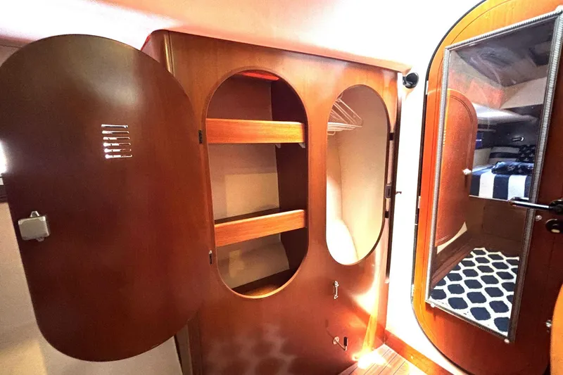 Slide: The Image of Interior of 2000 Fountaine Pajot Maryland 37 yacht with wooden cabinetry and mirrored door. - 65