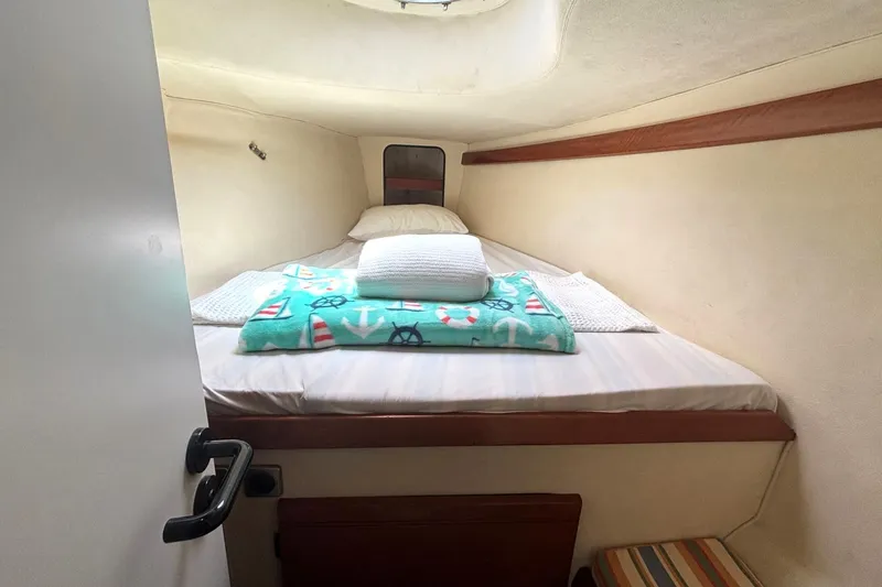 Slide: The Image of Cozy cabin interior of 2000 Fountaine Pajot Maryland 37 with nautical-themed bedding. - 66