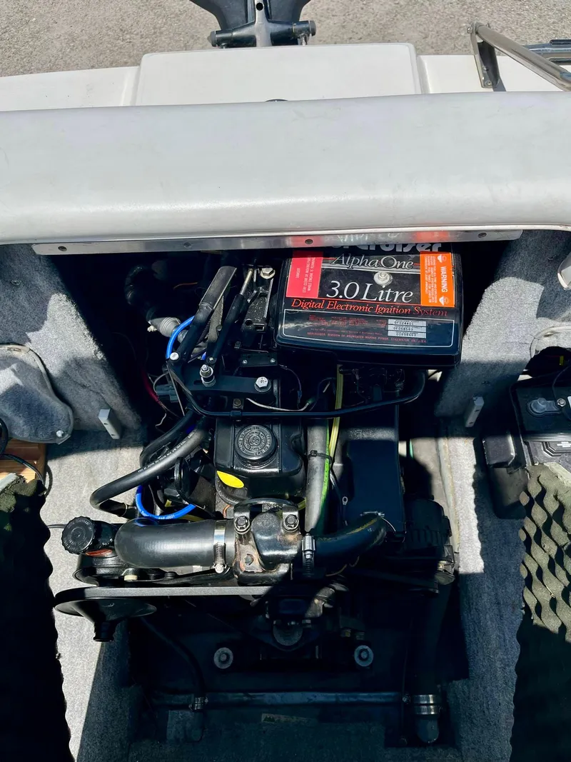 Slide: The Image of Engine compartment of a 1993 Sea Ray 170 BRLTD boat, featuring a 3.0-liter engine. - 11