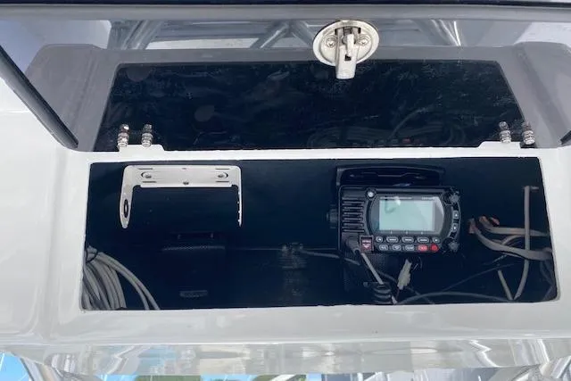 Slide: The Image of Control panel of 2025 Custom Carolina Forbes boat with dual screens and steering wheel. - 11