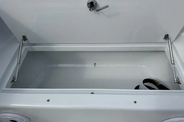 Slide: The Image of Open cooler on Custom Carolina Forbes 2025 boat with assorted drinks inside. - 16