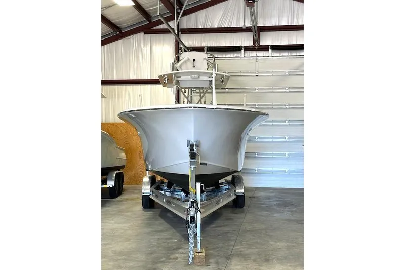Slide: The Image of 2025 Custom Carolina Forbes boat on trailer in a garage setting. - 27