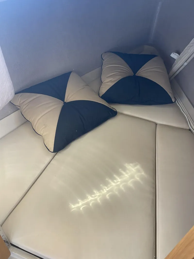 Slide: The Image of Cuddy cabin interior of 2008 Duffy Cuddy 22 with cushions and soft lighting. - 2