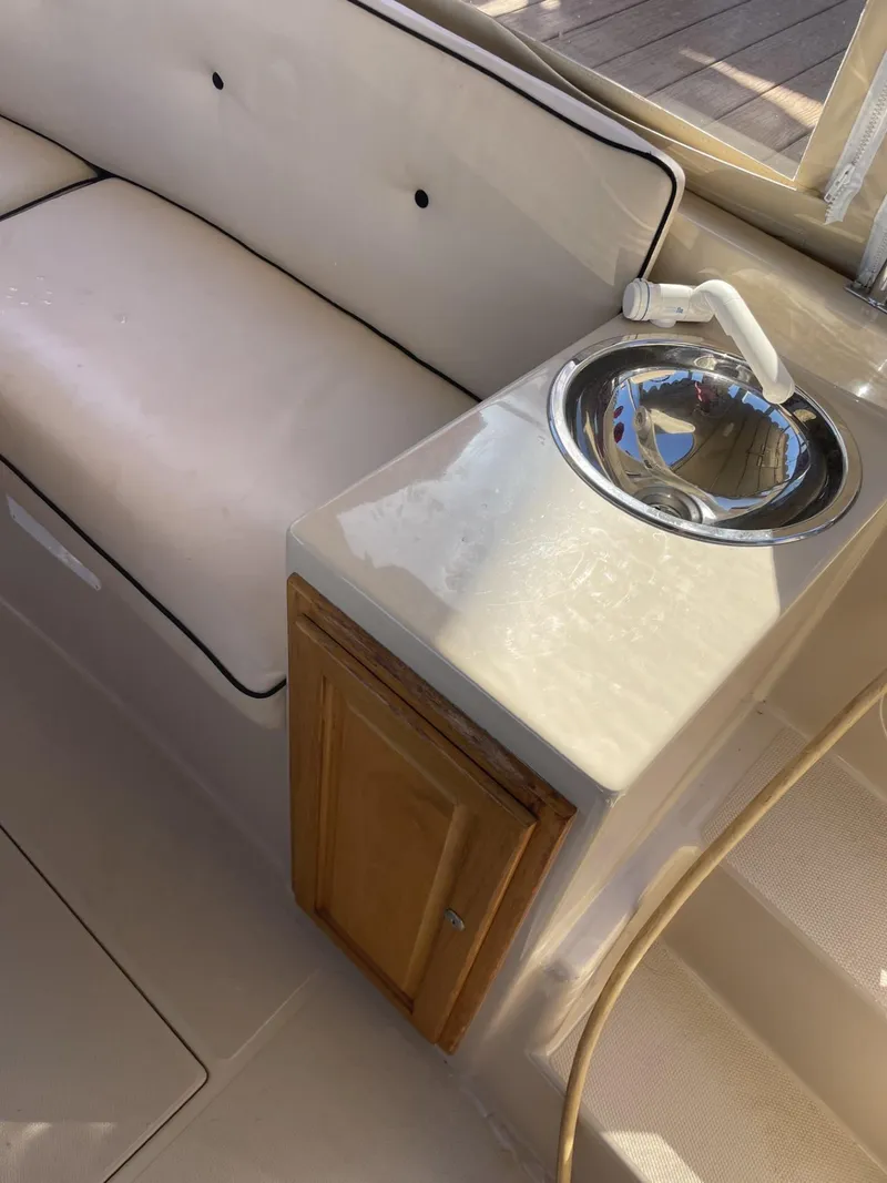 Slide: The Image of Interior of 2008 Duffy Cuddy 22 boat with seating and small sink. - 8