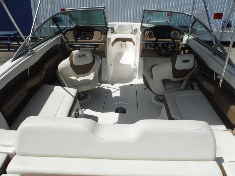 Slide: The Image of Interior of 2015 Chaparral 226 SSi boat with seating and dashboard. - 12