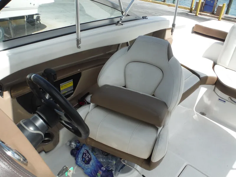 Slide: The Image of 2015 Chaparral 226 SSi boat interior with steering wheel and captain's seat. - 17