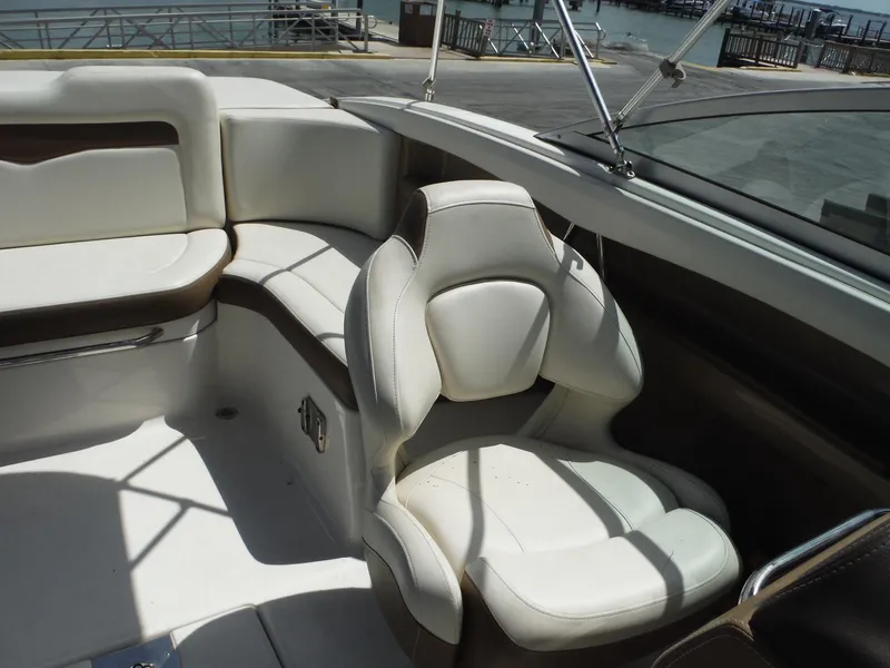 Slide: The Image of Interior of 2015 Chaparral 226 SSi boat with white and brown seating. - 18