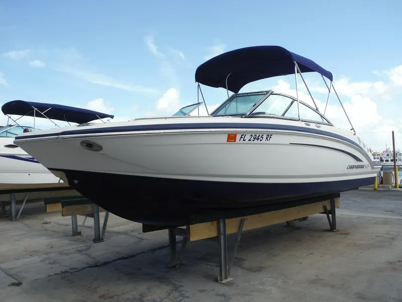 Slide: The Image of 2015 Chaparral 226 SSi boat with blue canopy on display. - 2
