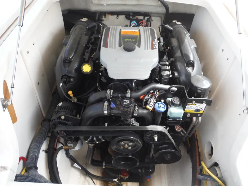 Slide: The Image of Engine compartment of 2015 Chaparral 226 SSi boat, showcasing detailed mechanical components. - 22