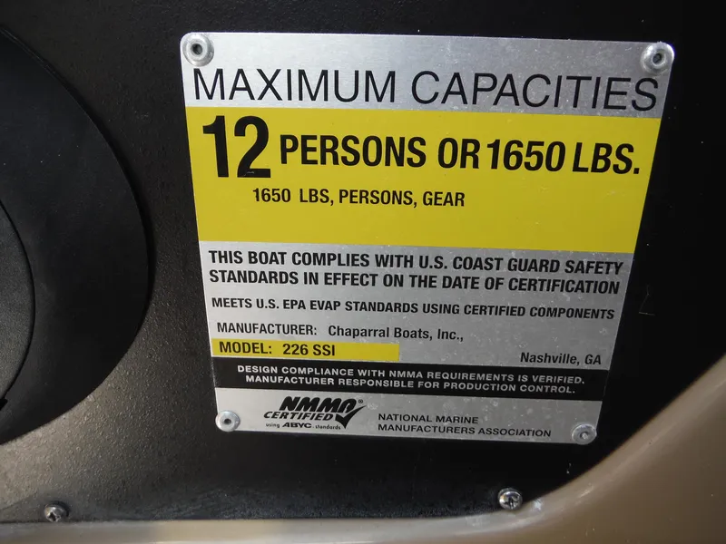 Slide: The Image of 2015 Chaparral 226 SSi capacity plate, 12 persons or 1650 lbs, safety compliance details. - 24