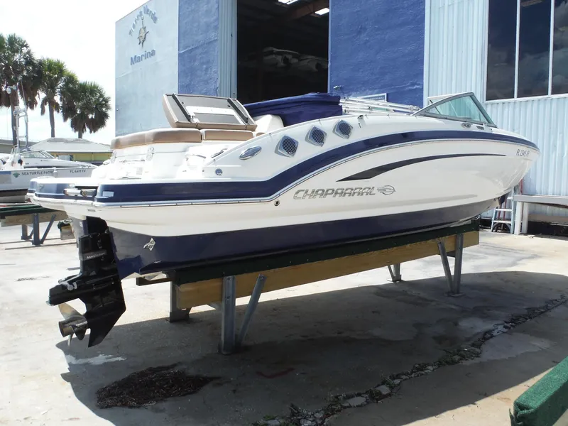 Slide: The Image of 2015 Chaparral 226 SSi boat on display at a marina. - 32