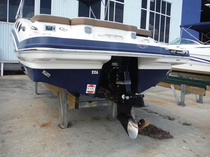 Slide: The Image of 2015 Chaparral 226 SSi boat on display, featuring a sleek blue and white design. - 5