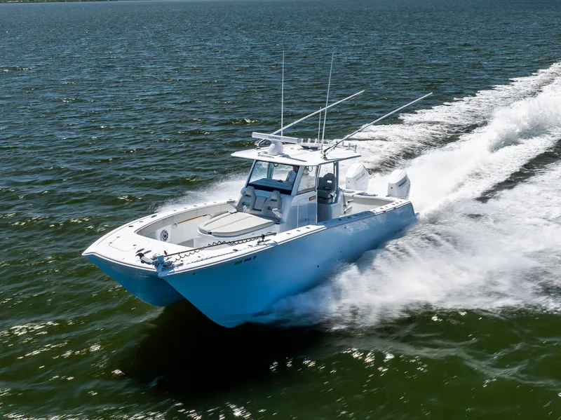 The Image of 2024 Freeman 35 boat cruising swiftly on open water. - 0