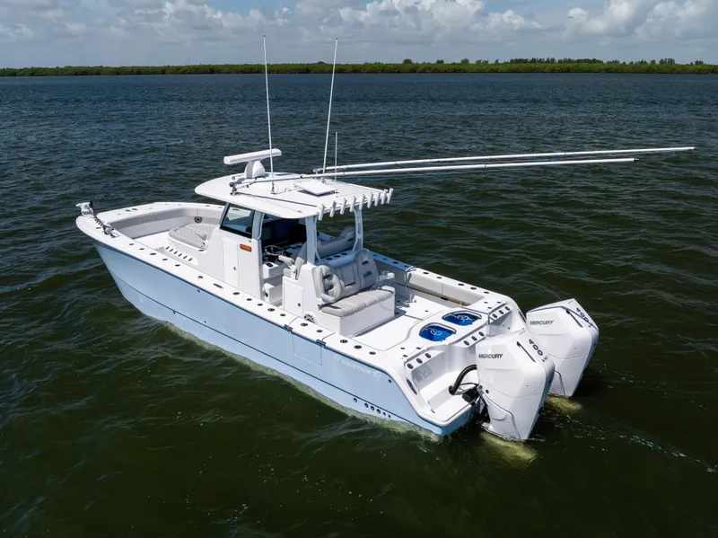 Slide: The Image of 2024 Freeman 35 boat with dual Mercury engines on open water. - 15