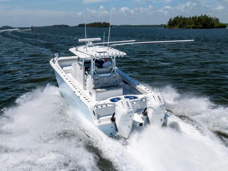 Slide: The Image of 2024 Freeman 35 boat cruising on open water with twin engines. - 21