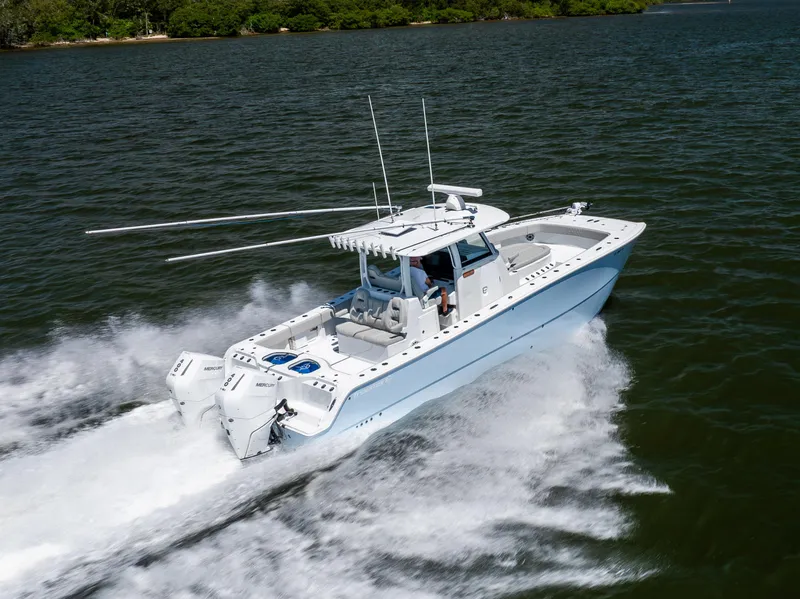 Slide: The Image of 2024 Freeman 35 boat cruising on water, showcasing sleek design and powerful engines. - 24