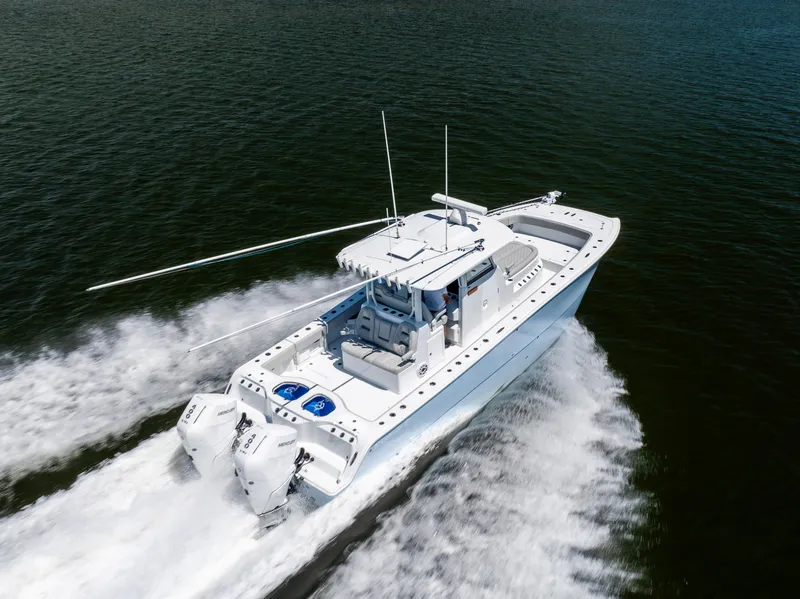 Slide: The Image of 2024 Freeman 35 boat cruising swiftly on open water. - 25