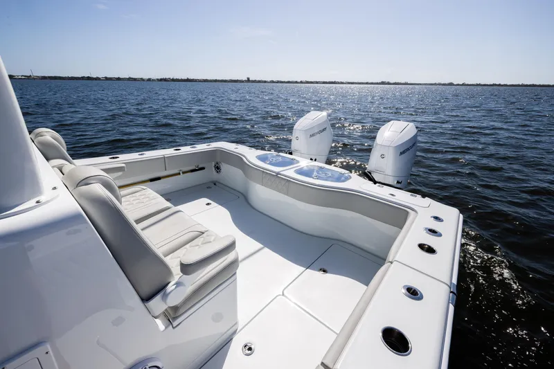 Slide: The Image of 2024 Freeman 35 boat with dual Mercury engines on open water. - 27