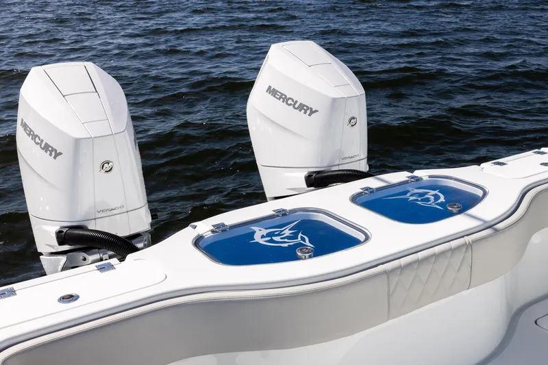 Slide: The Image of 2024 Freeman 35 boat with dual Mercury Verado engines on the water. - 29