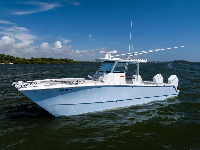 Slide: The Image of 2024 Freeman 35 boat on open water under clear blue sky. - 3