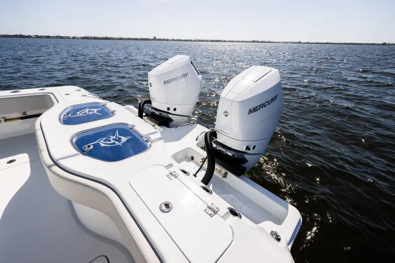 Slide: The Image of 2024 Freeman 35 boat with dual Mercury outboard engines on open water. - 31