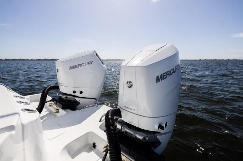 Slide: The Image of 2024 Freeman 35 boat with dual Mercury outboard engines on open water. - 32