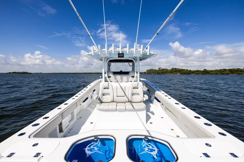 Slide: The Image of 2024 Freeman 35 boat on open water under clear blue sky. - 33