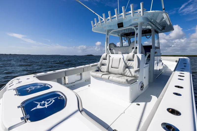 Slide: The Image of 2024 Freeman 35 boat with sleek design on open water under blue sky. - 35