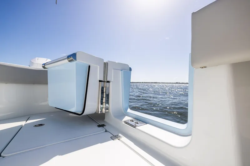 Slide: The Image of 2024 Freeman 35 boat interior with open deck, overlooking sunny ocean view. - 39