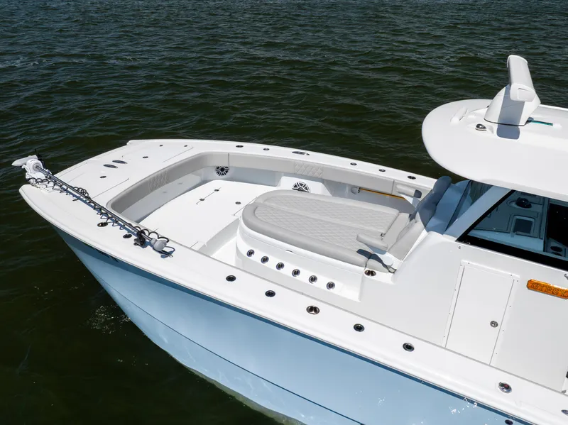 Slide: The Image of 2024 Freeman 35 boat on water, featuring sleek design and spacious deck. - 4