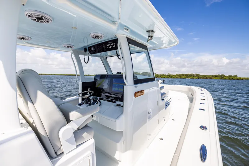 Slide: The Image of 2024 Freeman 35 boat interior with modern controls on open water. - 44