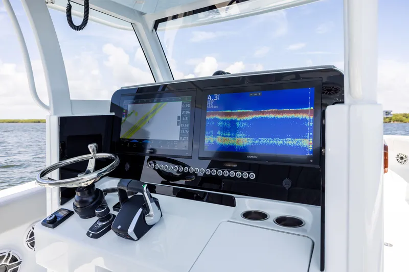 Slide: The Image of 2024 Freeman 35 boat dashboard with advanced navigation and control systems. - 46