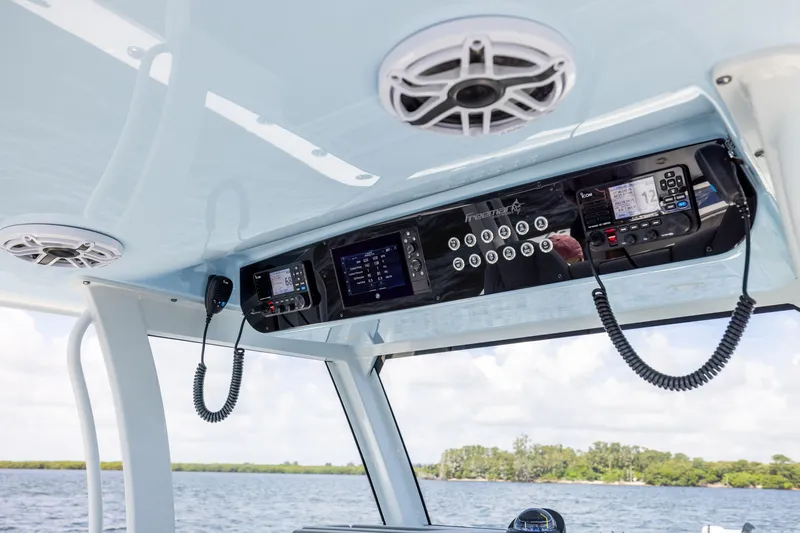 Slide: The Image of 2024 Freeman 35 boat dashboard with advanced navigation and communication systems. - 47
