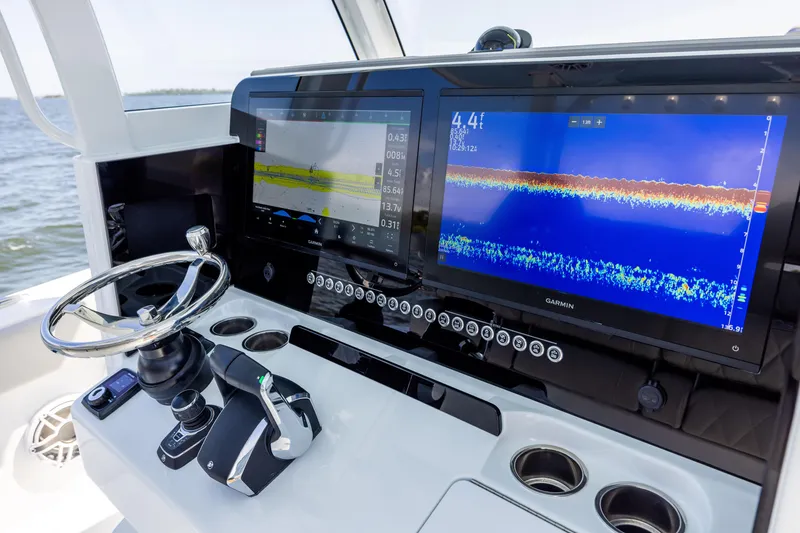 Slide: The Image of 2024 Freeman 35 boat dashboard with advanced navigation and control systems. - 48