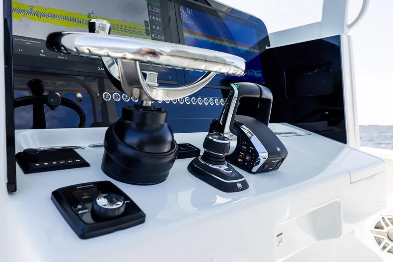 Slide: The Image of Control panel of a 2024 Freeman 35 boat with advanced navigation equipment. - 49