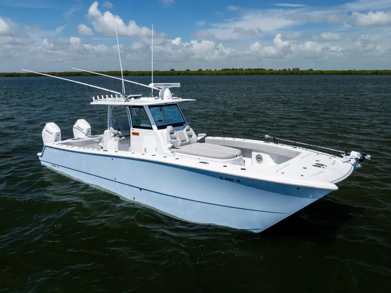 Slide: The Image of 2024 Freeman 35 boat on open water under blue sky. - 7