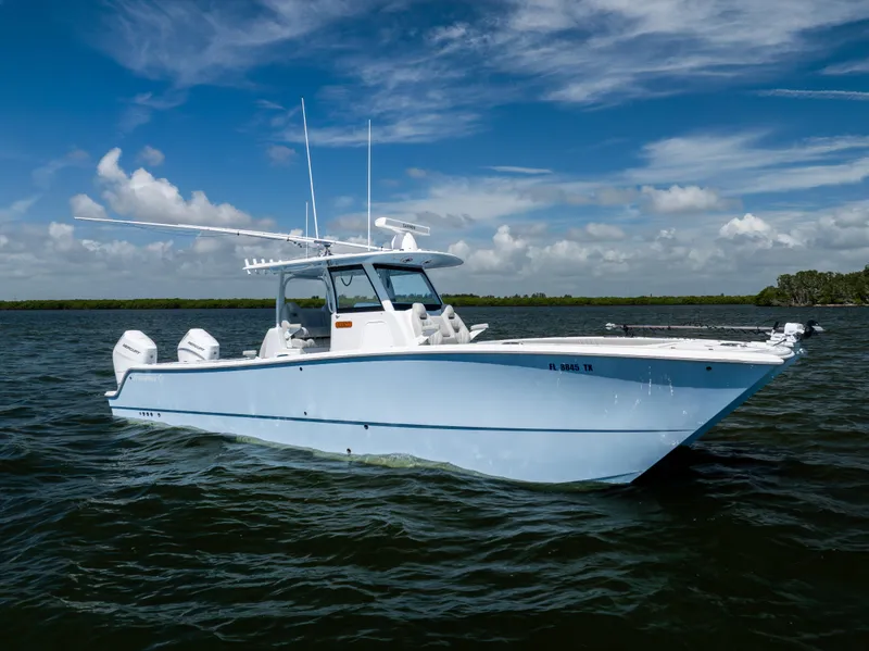 Slide: The Image of 2024 Freeman 35 boat on water under blue sky with clouds. - 8