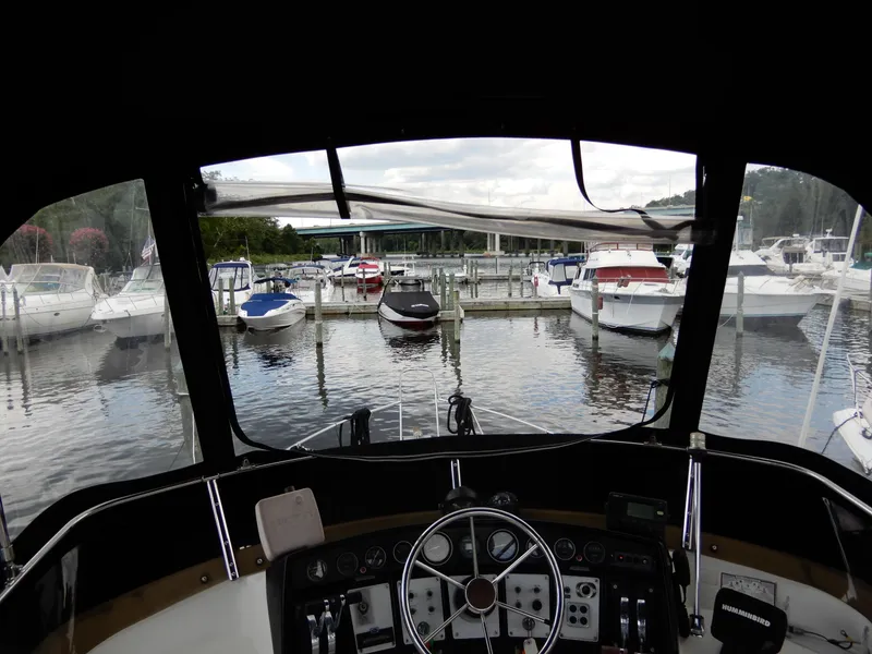 Slide: The Image of View from 1987 Carver 28 Mariner/Voyager helm, overlooking marina with docked boats. - 22